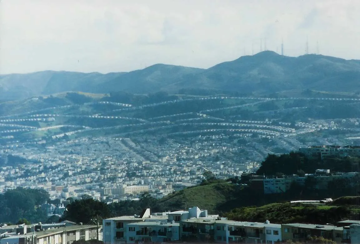 San Bruno Mountain rising behind Daly City rooftops