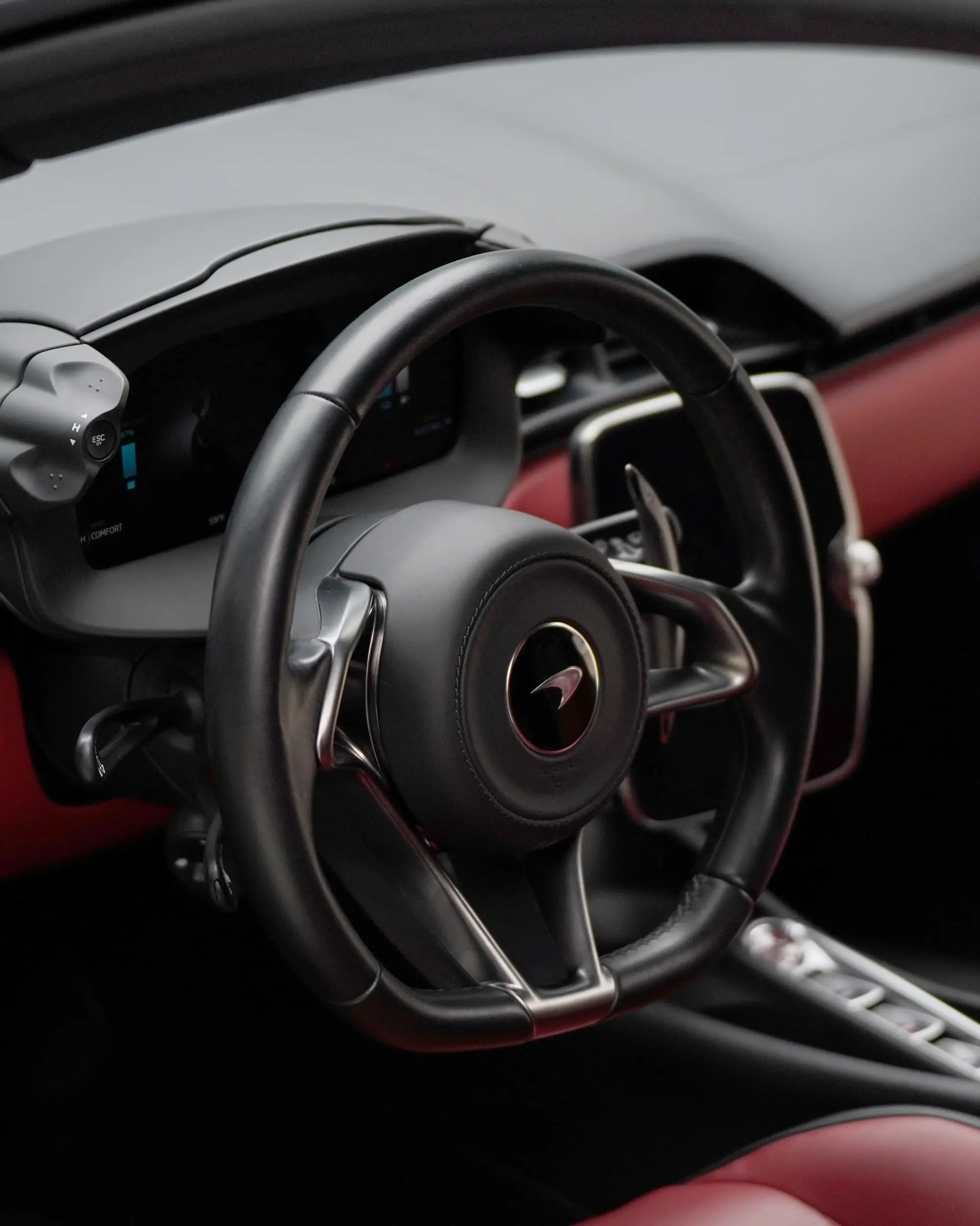 McLaren Artura interior, steering wheel and red leather