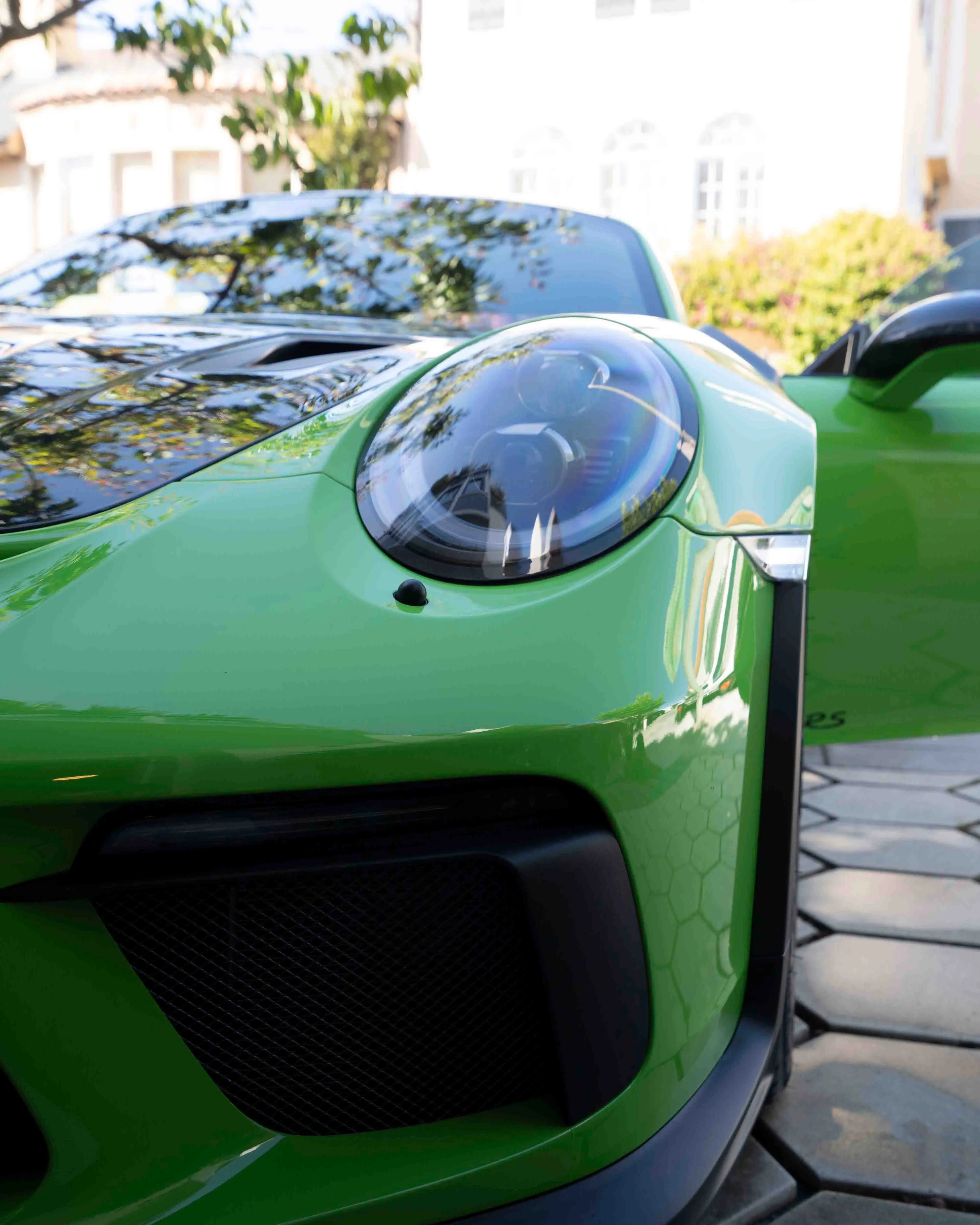 Green Porsche 911 GT3 RS front end after detailing