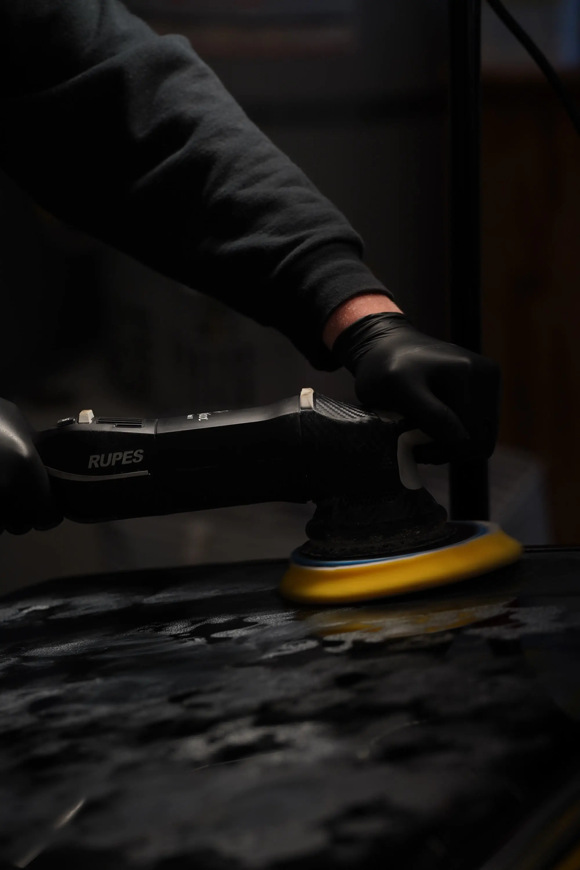 Ferrari 400i, Gloved hands with Rupes polisher on black paint