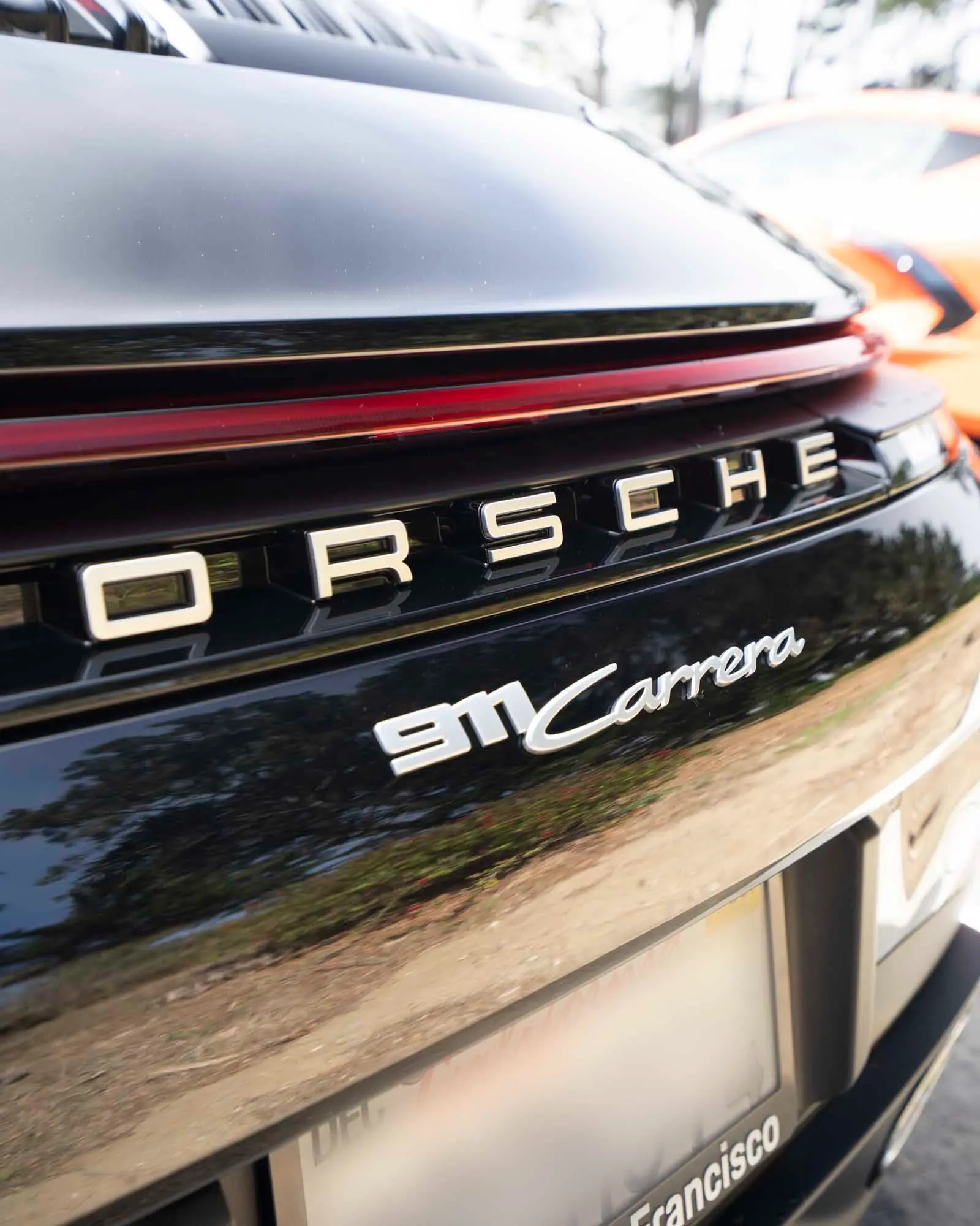 Porsche 911 Carrera rear badge closeup