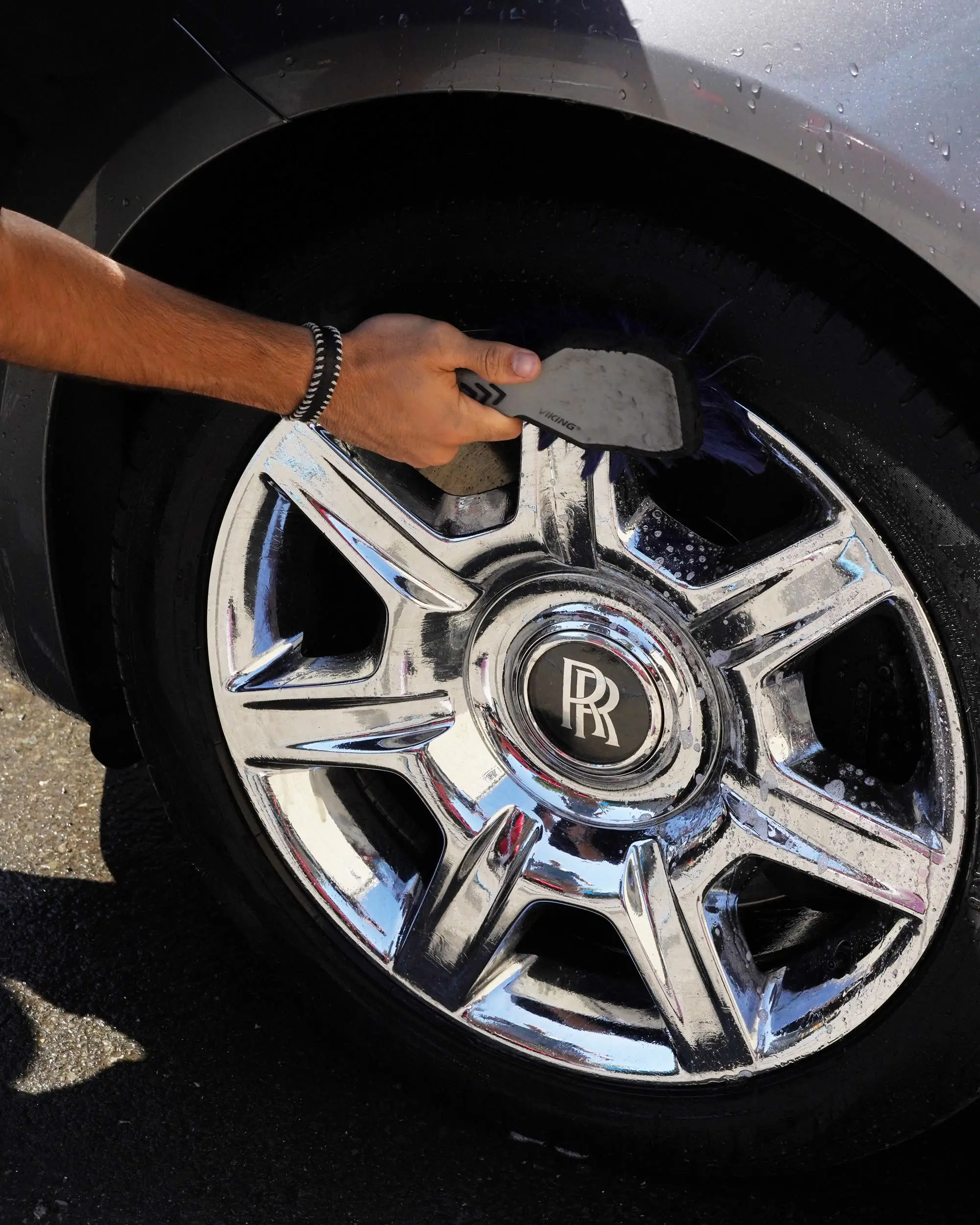 Rolls-Royce Ghost wheel being brushed